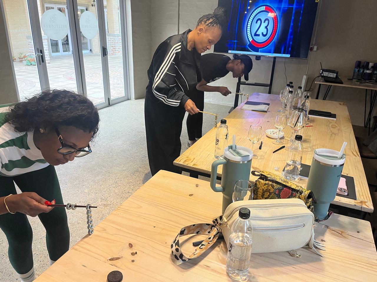 Colleagues racing a countdown clock in a Minute to Win It challenge